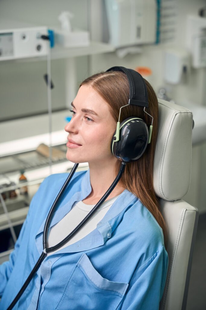 Patient with headphones during a medical examination